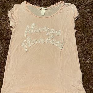 A cream color shirt, it’s a loose material and great for the summer!